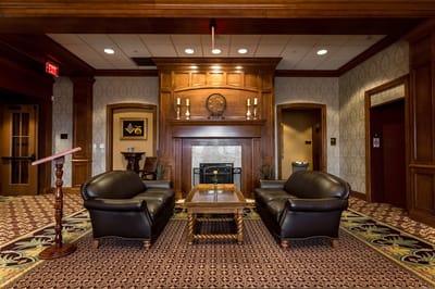 Interior seating area with leather sofas and a fireplace