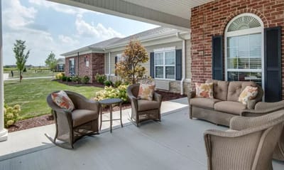 Outdoor seating area with landscaped garden view