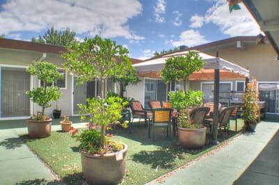 Outdoor garden area with seating and tables