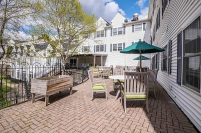 Outdoor seating area with patio tables and umbrellas