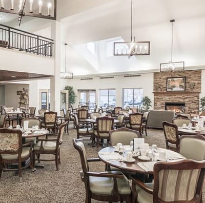 Dining area with tables and chairs ready for residents