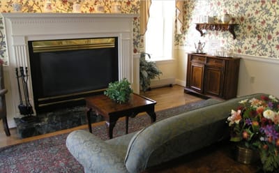 Cozy common area with a fireplace and floral decor