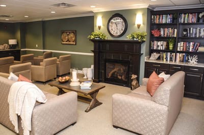 Common area with seating and bookshelves