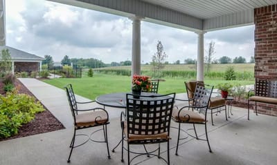 Outdoor seating area with a view of greenery