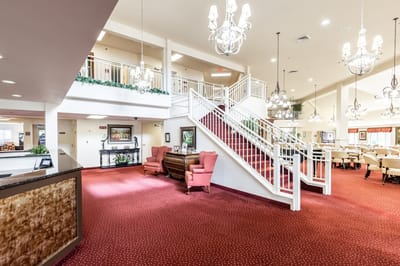Bright common area with seating and stairs