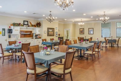 Bright dining area with tables and floral decor