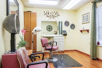 Hair salon area with styling chair and equipment