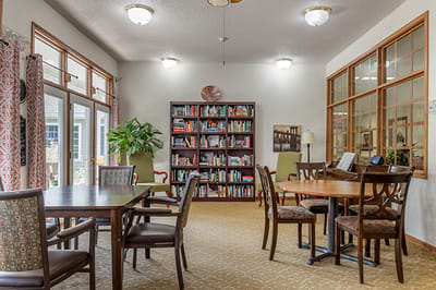 Bright common area with bookshelves and seating