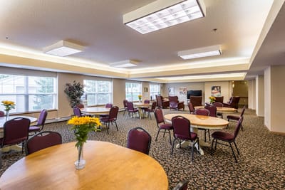 Bright common area with tables and chairs