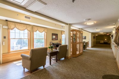 A well-lit common area with seating and decor