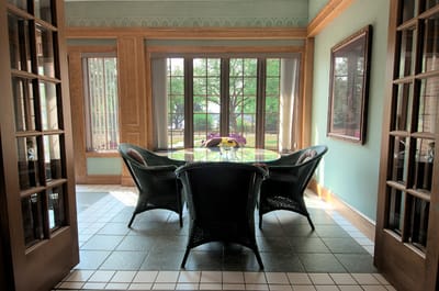 Bright sunroom with a table and chairs