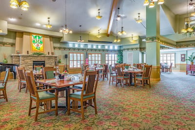 Dining area with tables set for residents