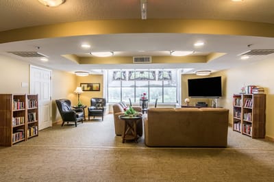 Cozy common area with seating and bookshelves
