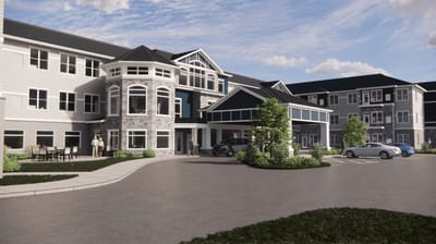 Exterior view of a senior living facility with residents present