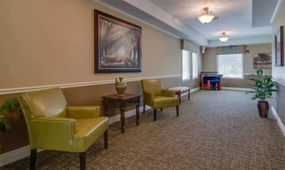 Interior hallway with chairs and artwork