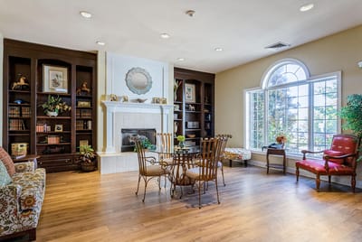 Cozy common area with comfortable seating and bookshelves