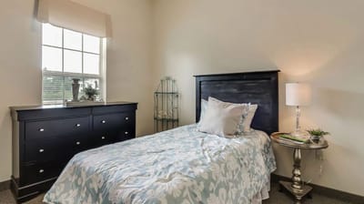 Cozy resident room with a single bed and natural light