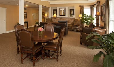 Bright common area with seating and a dining table
