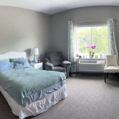 Cozy resident room with bed and seating area