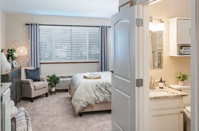 Bright private resident room with a bed and bathroom