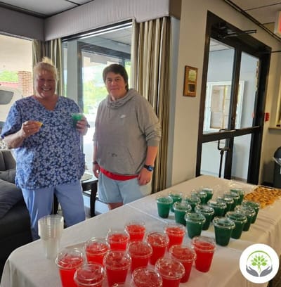 Residents and staff enjoying a colorful refreshment display