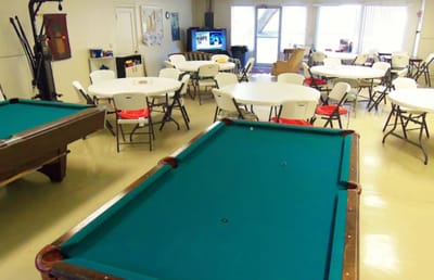Interior common area with tables and a pool table