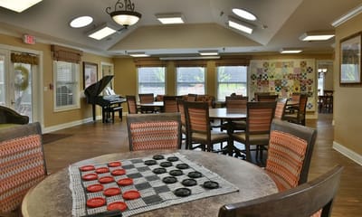 Common area with residents playing checkers