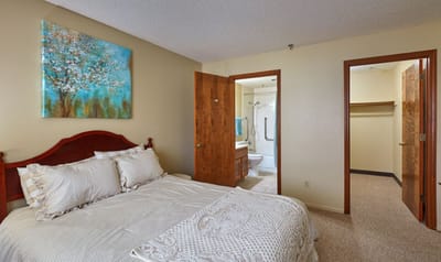 A well-furnished resident room with a bathroom