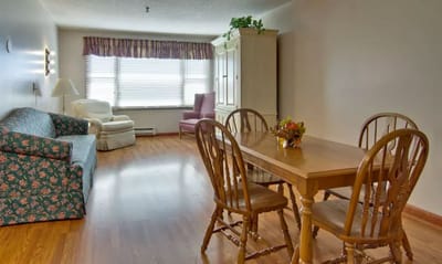 Cozy interior of a living unit with dining table