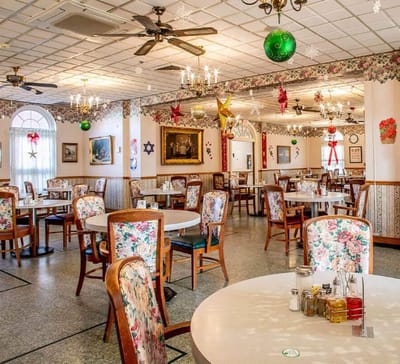 Dining room with festive decorations and floral table settings