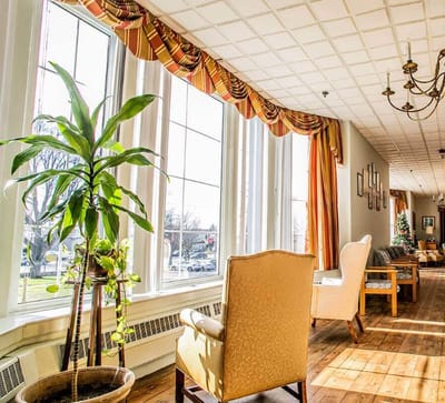Bright interior common area with large windows and seating