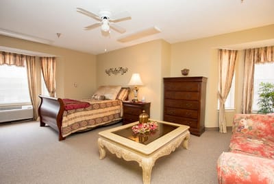 A well-furnished resident bedroom with cozy decor