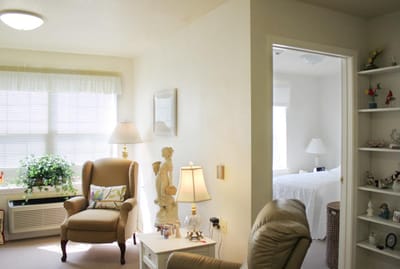 Interior view of a cozy resident room with seating