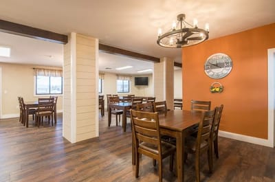 Bright dining area with wooden tables and chairs