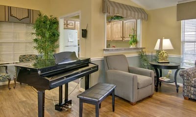 Cozy common area with a piano and seating