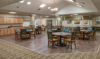 Bright dining area with wooden tables and chairs