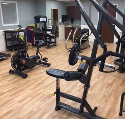 Well-equipped gym area in a senior living facility