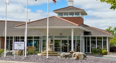 Front entrance of Reeve Court Village with water fountain