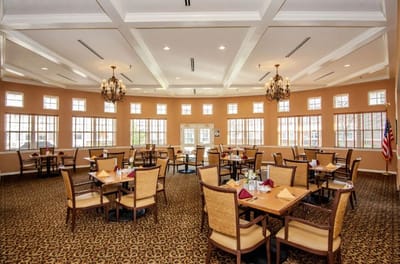 Elegant dining room with tables set for meals