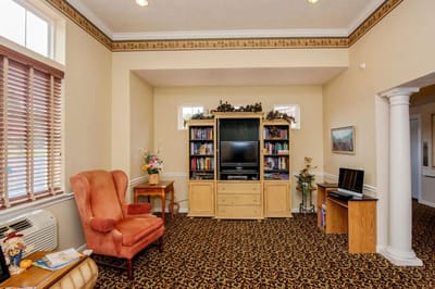 Cozy common area with bookshelves and seating