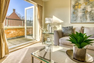 Bright interior living space with open door to outdoor area