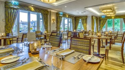 Elegant dining room setup with tables and chairs