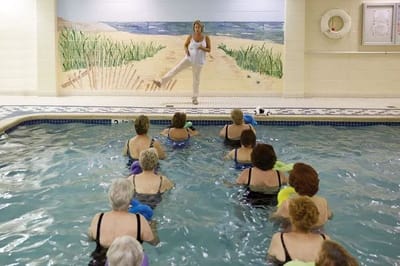 Seniors participating in a water aerobics class