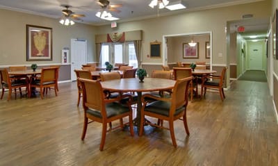 Bright dining area with tables and chairs