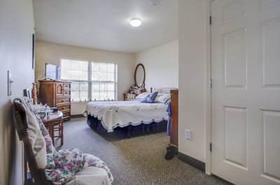 Private resident room with bed and window