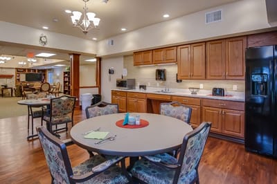 Bright dining area with kitchen and seating