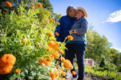 A couple enjoying time together in a vibrant garden