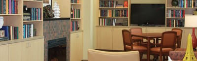 Common area with bookshelves and dining table