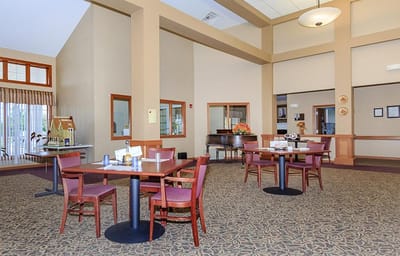 Interior view of a common area with tables and chairs