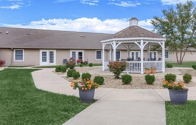 Beautiful outdoor gazebo surrounded by manicured gardens